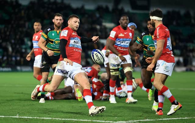 Finn Russell of Racing 92 kicks the ball upfield during the Heineken Champions Cup win over Northampton Saints (Photo by David Rogers/Getty Images)
