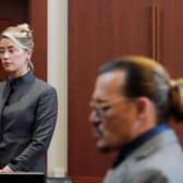 Amber Heard and Johnny Depp watch as the jury leave the courtroom for a lunch break at the court in Fairfax, Virginia (Picture: Steve Helber/pool/AFP via Getty Images)