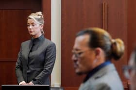 Amber Heard and Johnny Depp watch as the jury leave the courtroom for a lunch break at the court in Fairfax, Virginia (Picture: Steve Helber/pool/AFP via Getty Images)