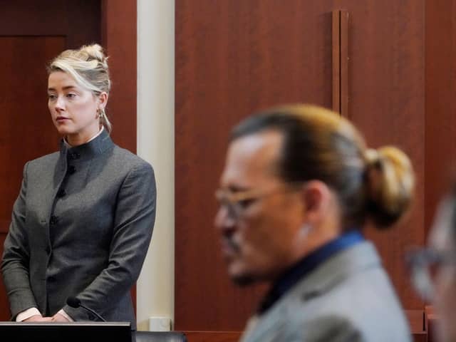 Amber Heard and Johnny Depp watch as the jury leave the courtroom for a lunch break at the court in Fairfax, Virginia (Picture: Steve Helber/pool/AFP via Getty Images)