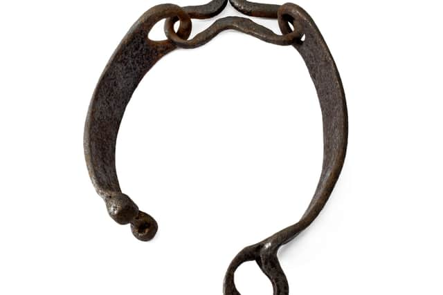 Jougs, an iron collar, were secured around the neck and fastened to the wall of a church on the 'witches ring' via a short chain. They were used for punishment and to warn others of the consequences of defying the church. PIC: Aberdeen University.