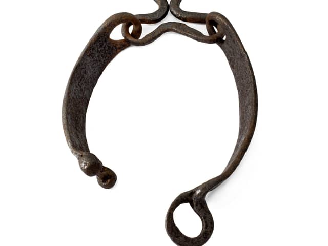 Jougs, an iron collar, were secured around the neck and fastened to the wall of a church on the 'witches ring' via a short chain. They were used for punishment and to warn others of the consequences of defying the church. PIC: Aberdeen University.