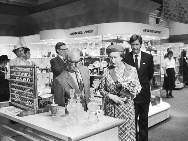 Queen Elizabeth II can be seen here chatting with Fred Lonie at the Edinburgh crystal department of Jenners as she visits the 150th anniversary exhibition. Year: 1988