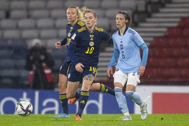 Scotland’s Lucy Graham and Spain’s Aitana Bonmati compete for the ball at Hampden Park (Photo by Ross MacDonald / SNS Group)