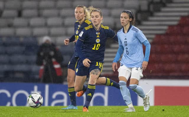 Scotland’s Lucy Graham and Spain’s Aitana Bonmati compete for the ball at Hampden Park (Photo by Ross MacDonald / SNS Group)