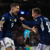 Scotland's Lyndon Dykes celebrates with Ryan Fraser after scoring to make it 2-0 during their UEFA Nations League match against Ukraine at Hampden Park. Photo by Craig Foy / SNS Group)