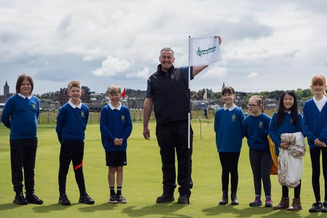 Gordon McKie, greenkeeping operations manager at St Andrews Links Trust, pictured with some of the pupils who took part in the First Green event. Picture: St Andrews Links