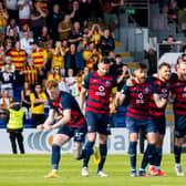 Ross County celebrate after winning the Premiership play-off final on penalties. (Photo by Ross Parker / SNS Group)