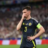 Scotland captain Andy Robertson looks dejected during the 5-1 defeat to Germany in the Euro 2024 opener. (Photo by Carl Recine/Getty Images)