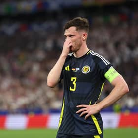 Scotland captain Andy Robertson looks dejected during the 5-1 defeat to Germany in the Euro 2024 opener. (Photo by Carl Recine/Getty Images)