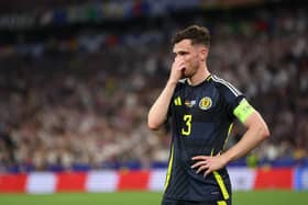 Scotland captain Andy Robertson looks dejected during the 5-1 defeat to Germany in the Euro 2024 opener. (Photo by Carl Recine/Getty Images)