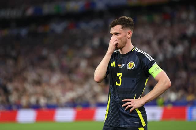 Scotland captain Andy Robertson looks dejected during the 5-1 defeat to Germany in the Euro 2024 opener. (Photo by Carl Recine/Getty Images)