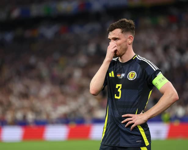 Scotland captain Andy Robertson looks dejected during the 5-1 defeat to Germany in the Euro 2024 opener. (Photo by Carl Recine/Getty Images)