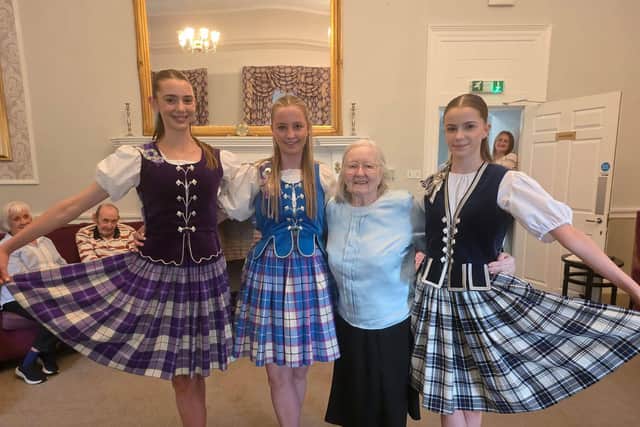Highland dancers at HC-One Scotland’s Murrayfield House Care Home with resident