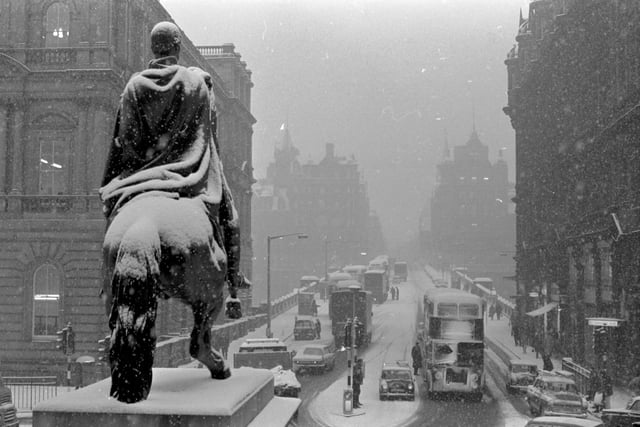 Traffic in North Bridge Edinburgh during the snow showers in February 1969.