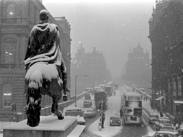 Traffic in North Bridge Edinburgh during the snow showers in February 1969.
