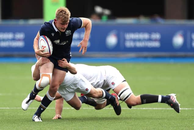 Scotland's try-scorer Christian Townsend is tackled during the Under-20 Six Nations match against England at Cardiff Arms Park. Picture: David Davies/PA Wire