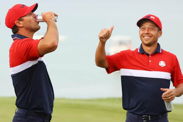 Brooks Koepka and Xander Schauffele celebrate a record-breaking 19-9 win for the US in the 43rd Ryder Cup in Wisconsin. Picture: Andrew Redington/Getty Images.