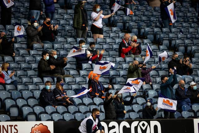Socially distanced Edinburgh fans take in the match against Glasgow Warriors at BT Murrayfield.