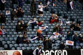 Socially distanced Edinburgh fans take in the match against Glasgow Warriors at BT Murrayfield.