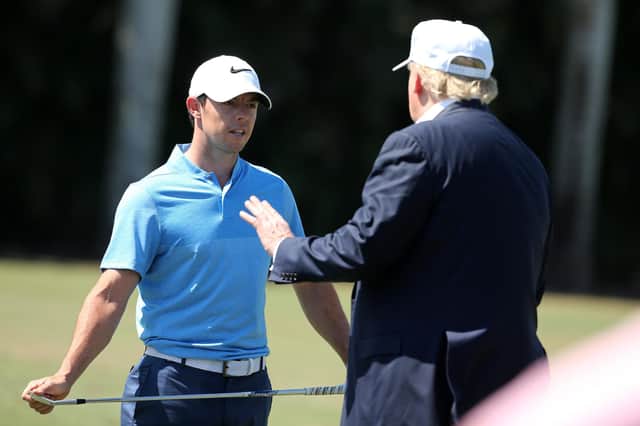 Donald Trump speaks with Rory McIlroy during the final round of the WGC-Cadillac Championship at Doral in 2016.