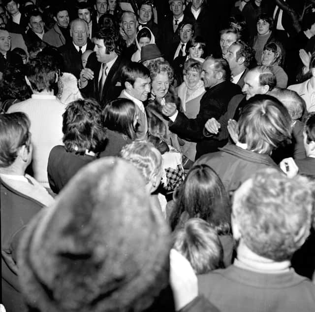 Crowds applaud Scottish Boxer Ken Buchanan when he arrives back in Edinburgh after retaining his world lightweight championship again Ruben Navarro.