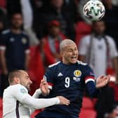 Scotland striker Lyndon Dykes leaves his mark on England defender Luke Shaw in the opening minute of the Euro 2020 Group D match at Wembley. (Photo by Andy Rain - Pool/Getty Images)