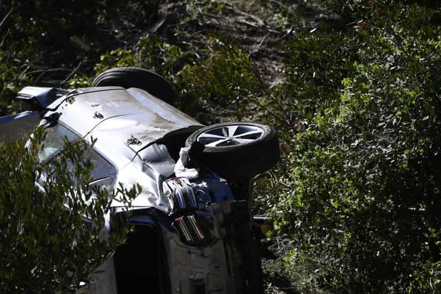 The vehicle driven by golfer Tiger Woods lies on its side in Rancho Palos Verdes, California, following the crash on February 23, 2021. (Photo by PATRICK T. FALLON/AFP via Getty Images)