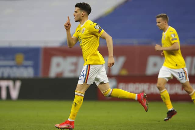 Romania's Ianis Hagi celebrates after scoring his side's third goal during the World Cup 2022 group J qualifying soccer match between Romania and North Macedonia at the National Arena stadium in Bucharest, Romania, Thursday, March 25, 2021. (AP Photo/Vadim Ghirda)