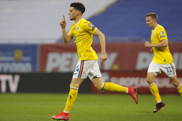 Romania's Ianis Hagi celebrates after scoring his side's third goal during the World Cup 2022 group J qualifying soccer match between Romania and North Macedonia at the National Arena stadium in Bucharest, Romania, Thursday, March 25, 2021. (AP Photo/Vadim Ghirda)