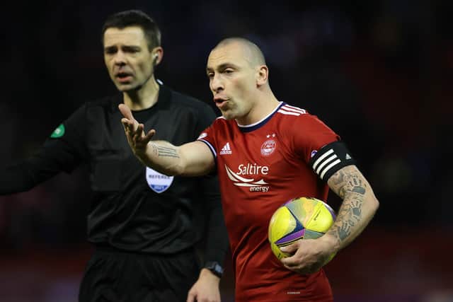 Aberdeen's Scott Brown gestures as referee Kevin Clancy looks on during the 1-1 draw with Rangers at Pittodrie. (Photo by Craig Williamson / SNS Group)