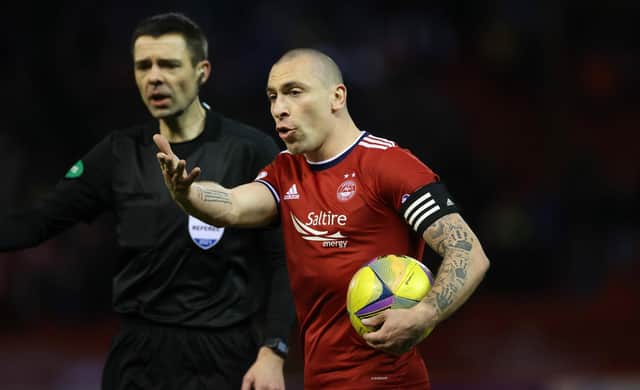 Aberdeen's Scott Brown gestures as referee Kevin Clancy looks on during the 1-1 draw with Rangers at Pittodrie. (Photo by Craig Williamson / SNS Group)