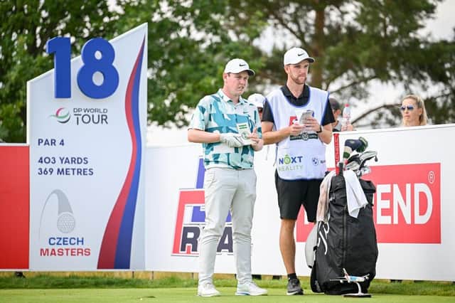 Bob MacIntyre mulls over a tee shot at the 18th with caddie Greg Milne during the D+D Real Czech Masters at Albatross Golf Resort in Prague. Picture: Octavio Passos/Getty Images.
