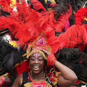 Performers parade along Princes Street in Edinburgh in the Edinburgh Festival Carnival. Performers from more than 13 countries, take part in the event. Picture date: Sunday July 17, 2022.