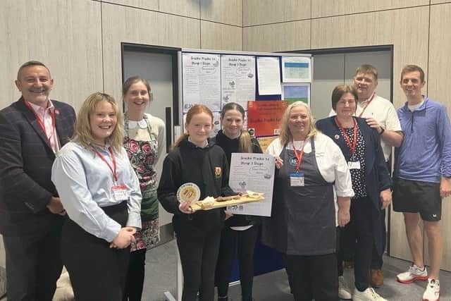Snacky Mackies winners with team members from ESS