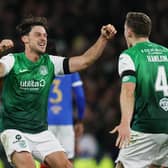 Paul Hanlon and Joe Newell celebrate Hibs' win at Hampden.