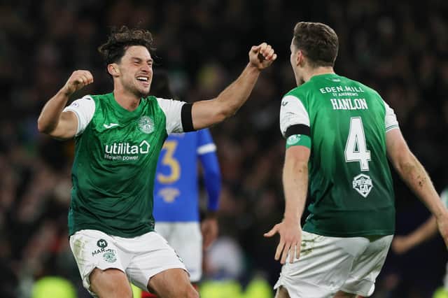 Paul Hanlon and Joe Newell celebrate Hibs' win at Hampden.