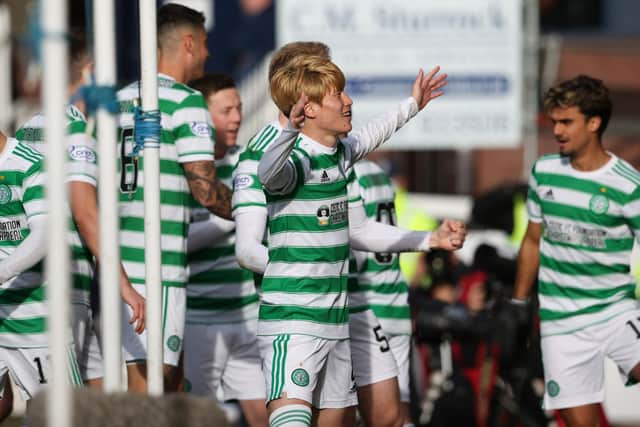 The Celtic players celebrate Kyogo Furuhashi's goal making it 4-1 during the cinch Premiership match between Dundee and Celtic at the Kilmac Stadium at Dens Park, on November 07, 2021.