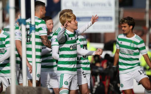 The Celtic players celebrate Kyogo Furuhashi's goal making it 4-1 during the cinch Premiership match between Dundee and Celtic at the Kilmac Stadium at Dens Park, on November 07, 2021.