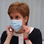 Nicola Sturgeon and health officials have repeatedly stressed the importance of wearing a facemask (Picture: Andrew Milligan/AFP via Getty Images)