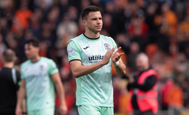 Former Hibs striker Mykola Kukharevych has signed a permanent contract with Swansea.