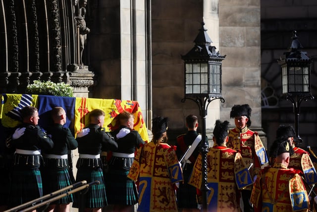 Pallbearers carry the coffin of Queen Elizabeth II from St Giles' Cathedral, Edinburgh, after a prayer service.