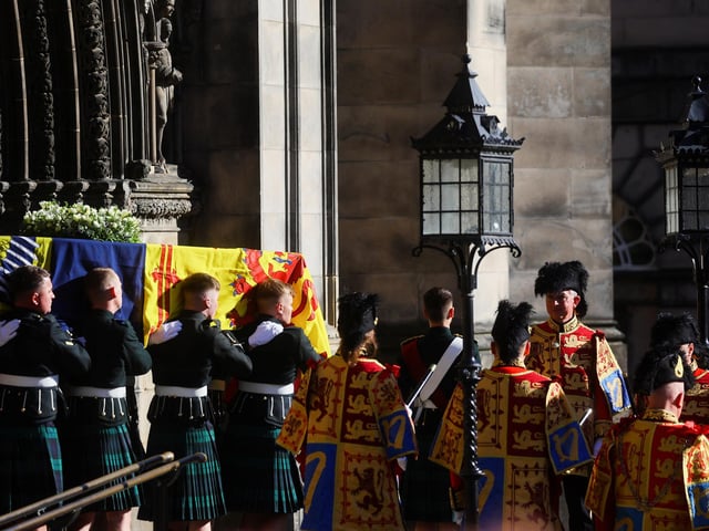 Pallbearers carry the coffin of Queen Elizabeth II from St Giles' Cathedral, Edinburgh, after a prayer service.