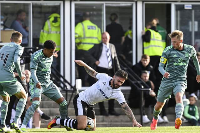 Celtic defender Stephen Welsh sports the armband as he marshalls Ayr United's George Oakley along with young teammates Kyle Ure (No 54) and Josh Dede (Photo by Rob Casey / SNS Group)