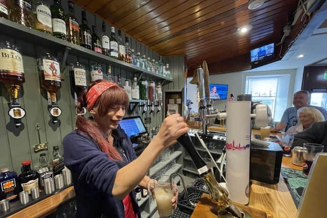 Pulling a pint at The Anchor Tavern in Port Bannantyne on the Isle of Bute, which is now in community ownership. PIC: Contributed.