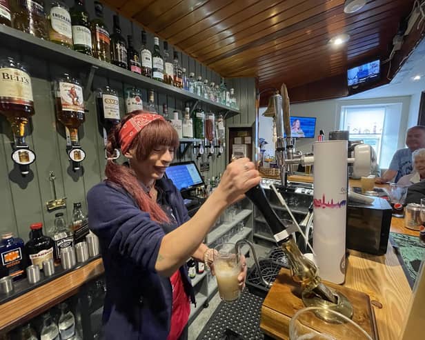 Pulling a pint at The Anchor Tavern in Port Bannantyne on the Isle of Bute, which is now in community ownership. PIC: Contributed.