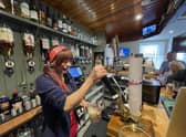 Pulling a pint at The Anchor Tavern in Port Bannantyne on the Isle of Bute, which is now in community ownership. PIC: Contributed.