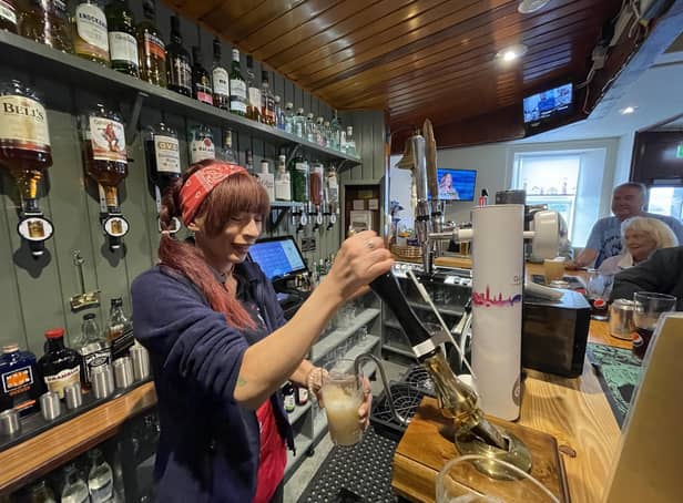 Pulling a pint at The Anchor Tavern in Port Bannantyne on the Isle of Bute, which is now in community ownership. PIC: Contributed.