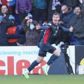 Matthew Wright celebrates after scoring Ross County's 96th minute equaliser in their 3-3 draw against Rangers in Dingwall. (Photo by Craig Williamson / SNS Group)