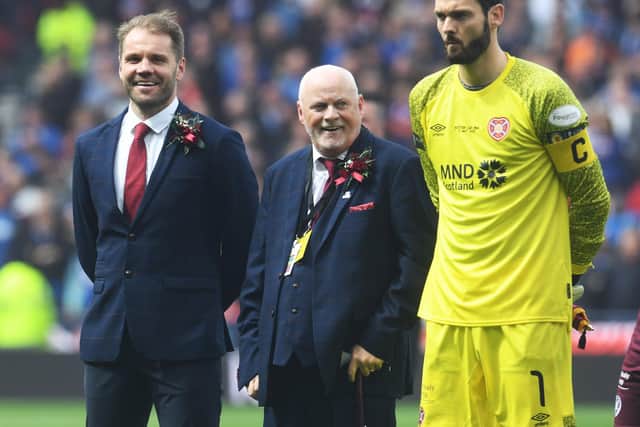 Lifelong Heart of Midlothian supporter, Stevie Morris, with Robbie Neilson and Craig Gordon during the Scottish Cup Final match between Rangers and Hearts at Hampden Park.